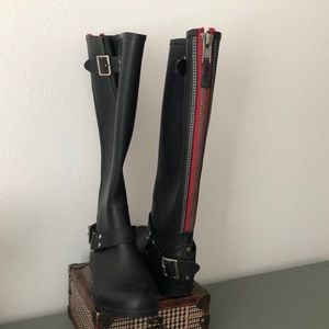 black boots with red stripe